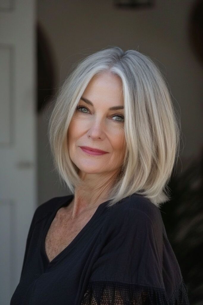 Minimalist midi haircut for a woman over 50 with sleek healthy-looking ends