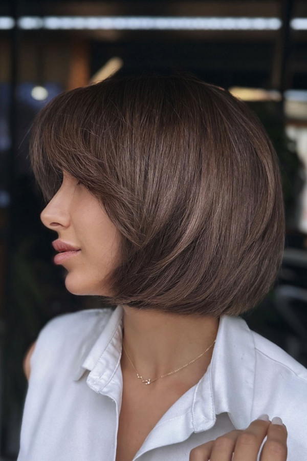 Soft rounded bob haircut with a smooth curved shape around the face